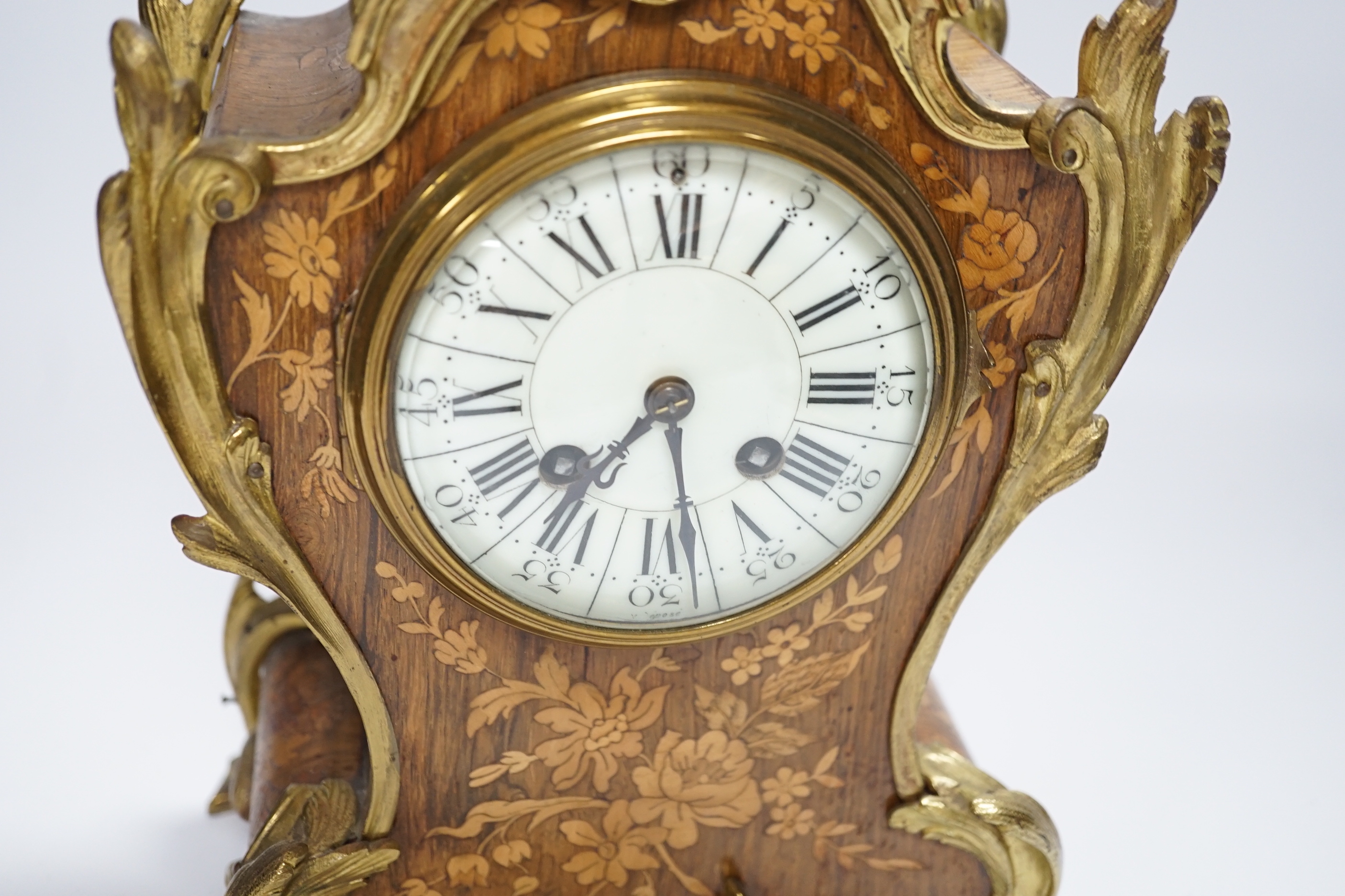 A French gilt metal mounted rosewood mantel clock. 40cm
